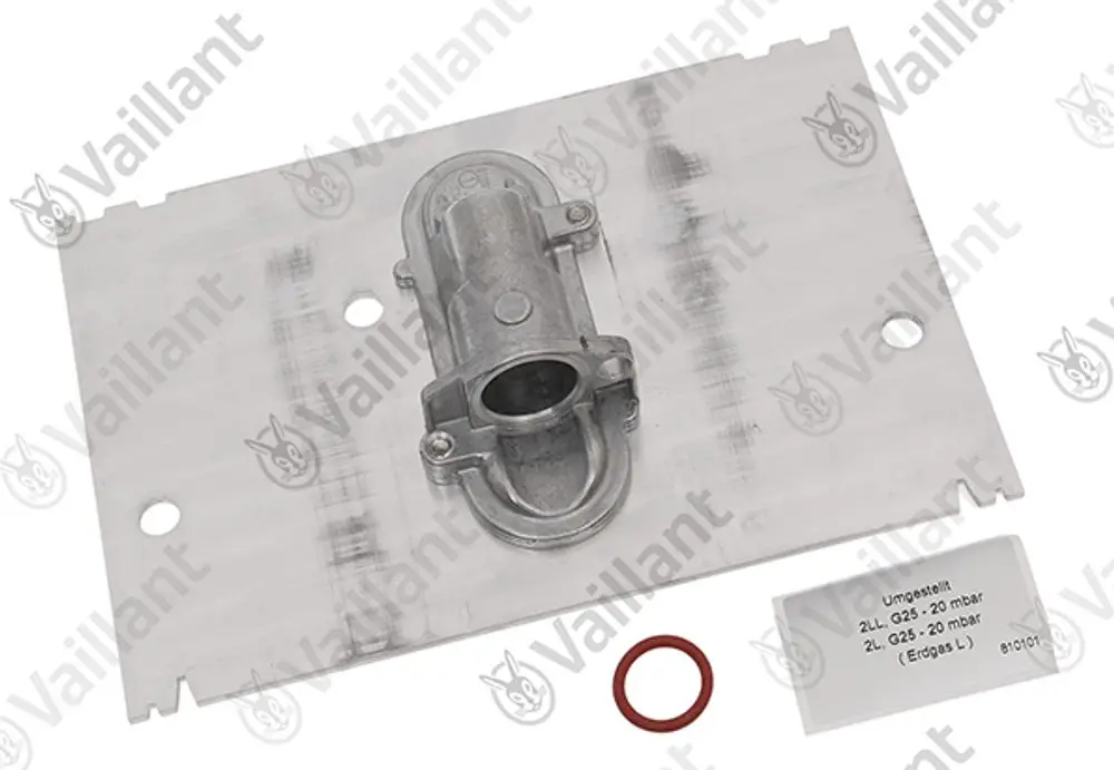 Vaillant Umstellsatz auf einer Metallplatte. Enthält ein Ventil und eine Dichtung. Beschriftung mit technischen Daten.